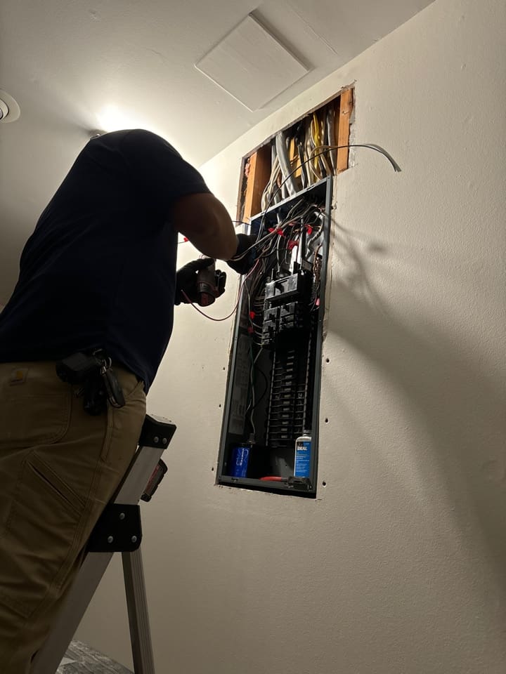 A replacement breaker panel installed in a townhouse utility closet