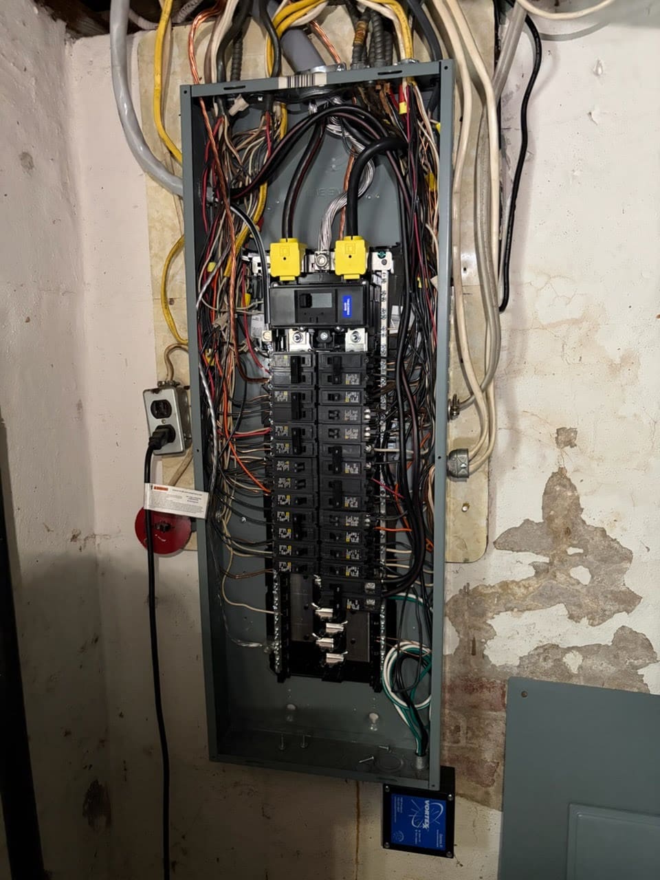 A newly installed residential electrical panel with breakers in place and circuits labeled