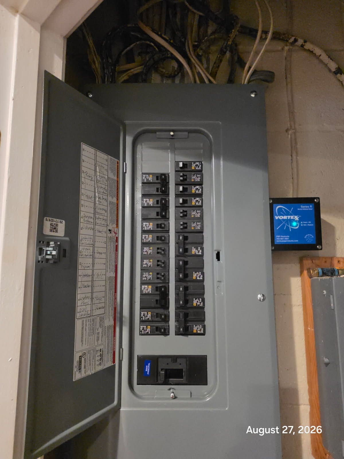 An upgraded electrical panel with a whole home surge protector installed at a home in Arlington, Virginia
