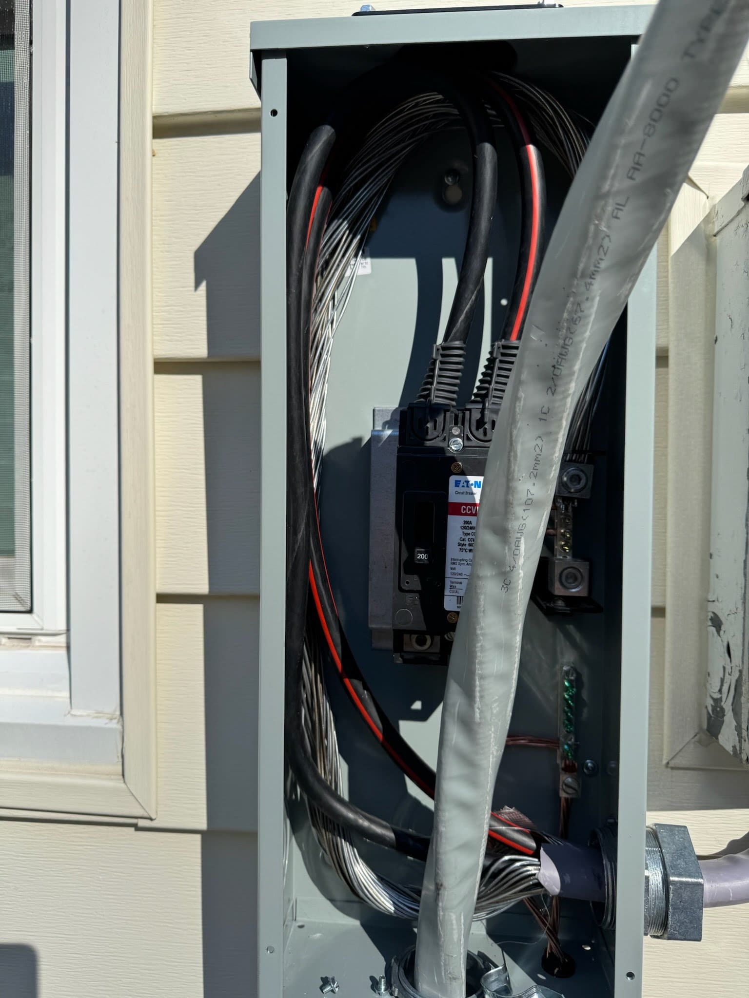 An exterior electrical disconnect switch mounted beside a meter