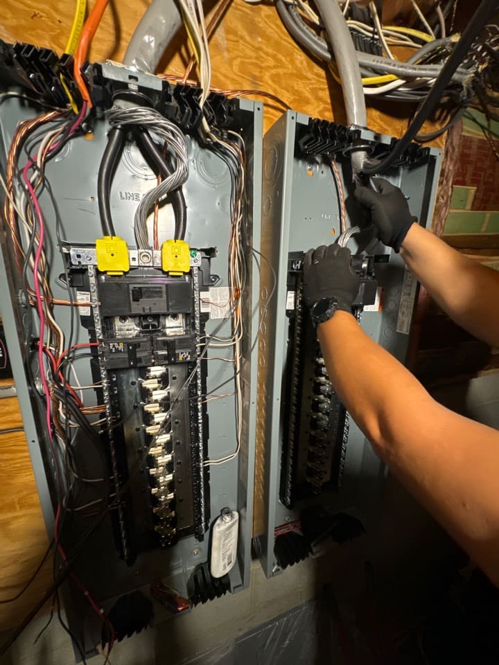 Two breaker panels mounted side by side in a Burke Virginia home