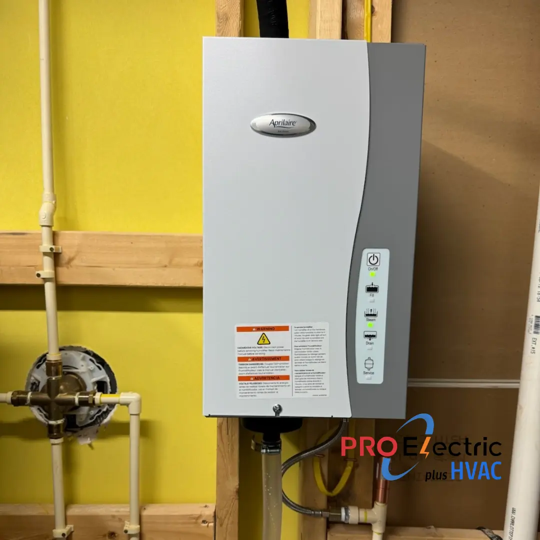 A whole house humidifier installed on residential ductwork