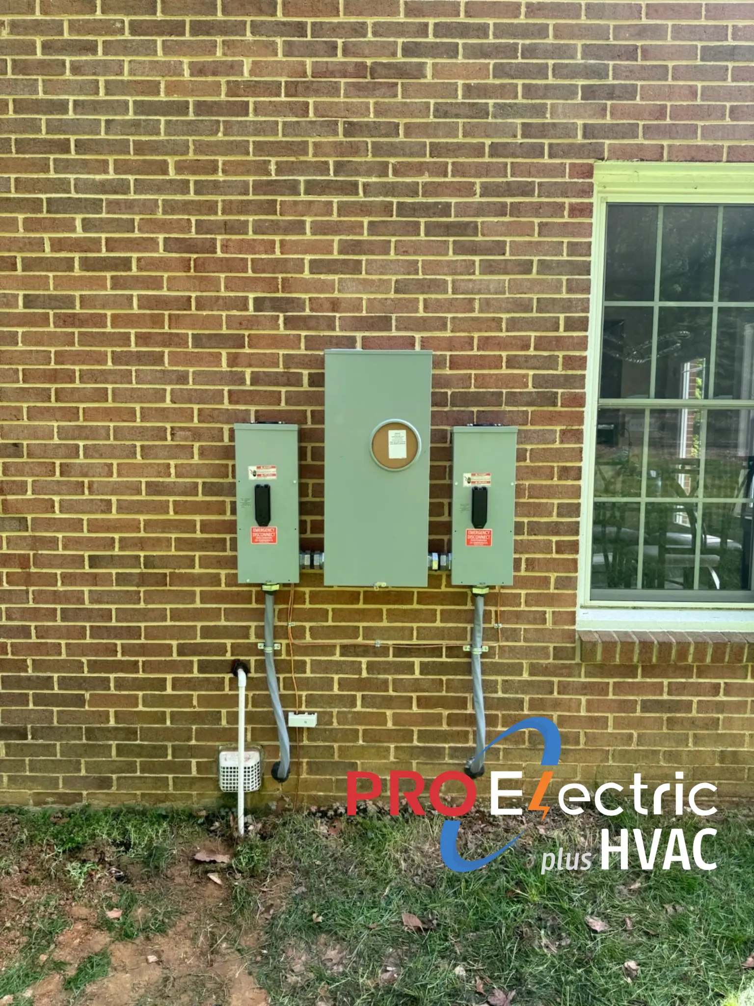 A newly installed meter base and service disconnect on a home exterior